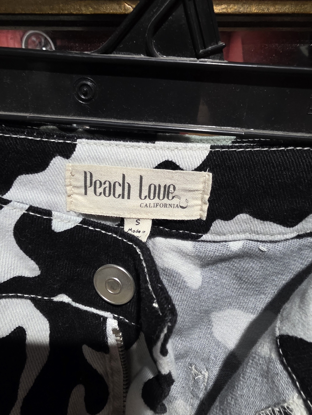 Peach Love California Black & White Cow Print Flare Jeans - Picture 2 of 3
